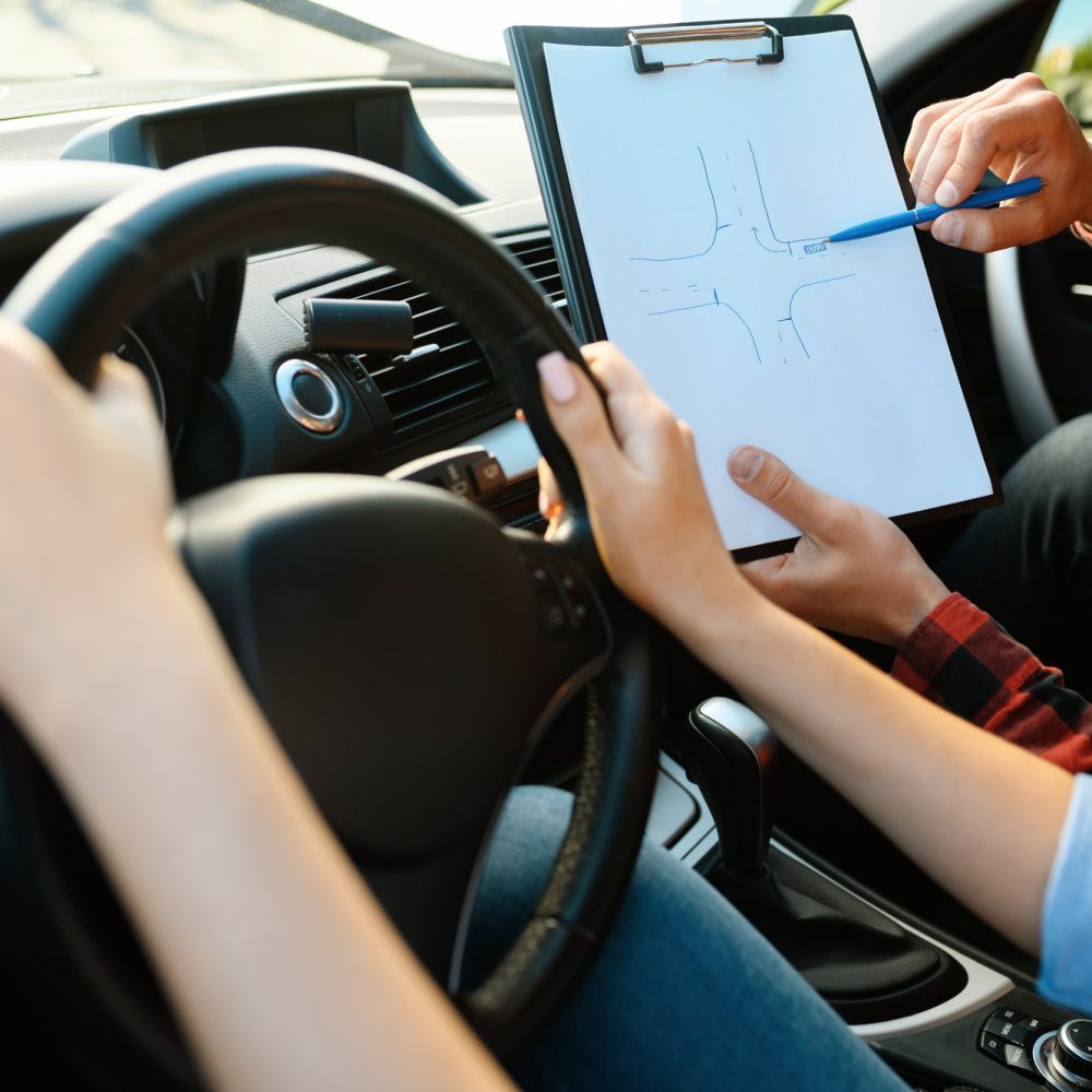 woman-and-man-with-checklist-driving-school-2.jpg woman-and-man-with-checklist-driving-school-2.jpg